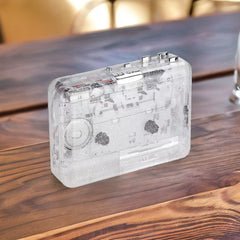 Transparent cassette player with both radio and tape playback functions